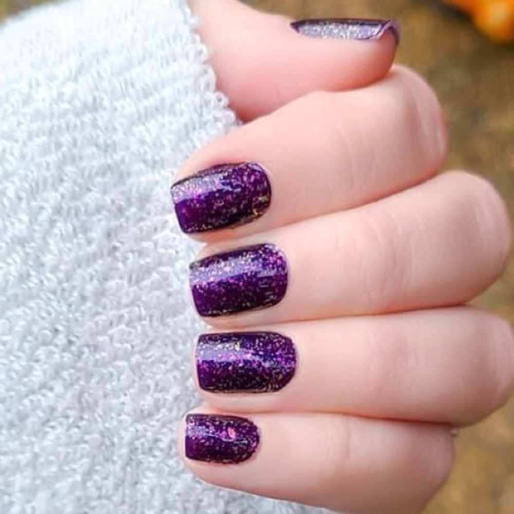 Color Street - Flake My Day, a bold deep eggplant, with lilac to gold flakes